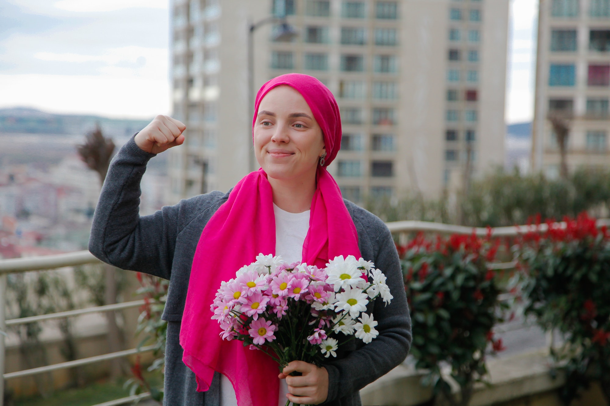 Cancer patient women with flowers in hand
